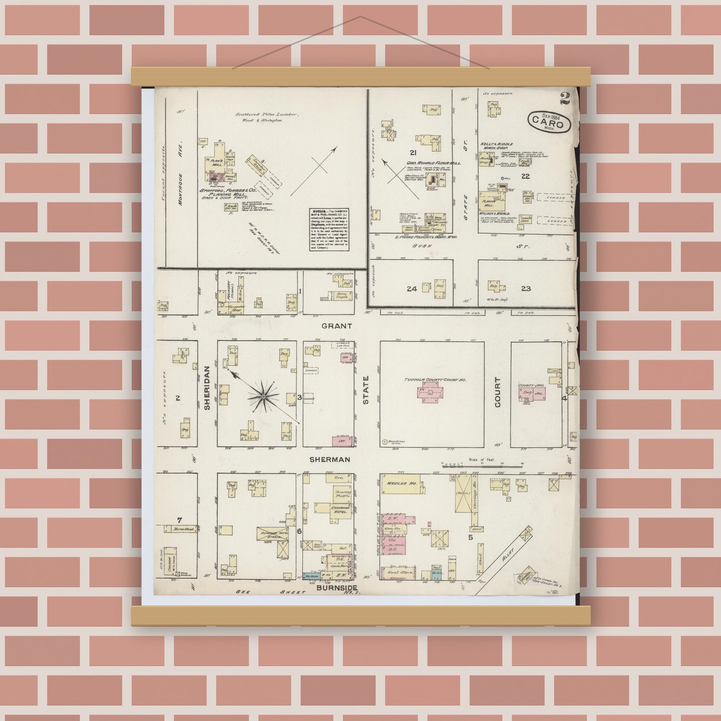 Old map wall art mockup — magnetic wood frame on brick wall — Sanborn Fire Insurance Map from Caro, Tuscola County, Michigan (1884), Sheet #0002