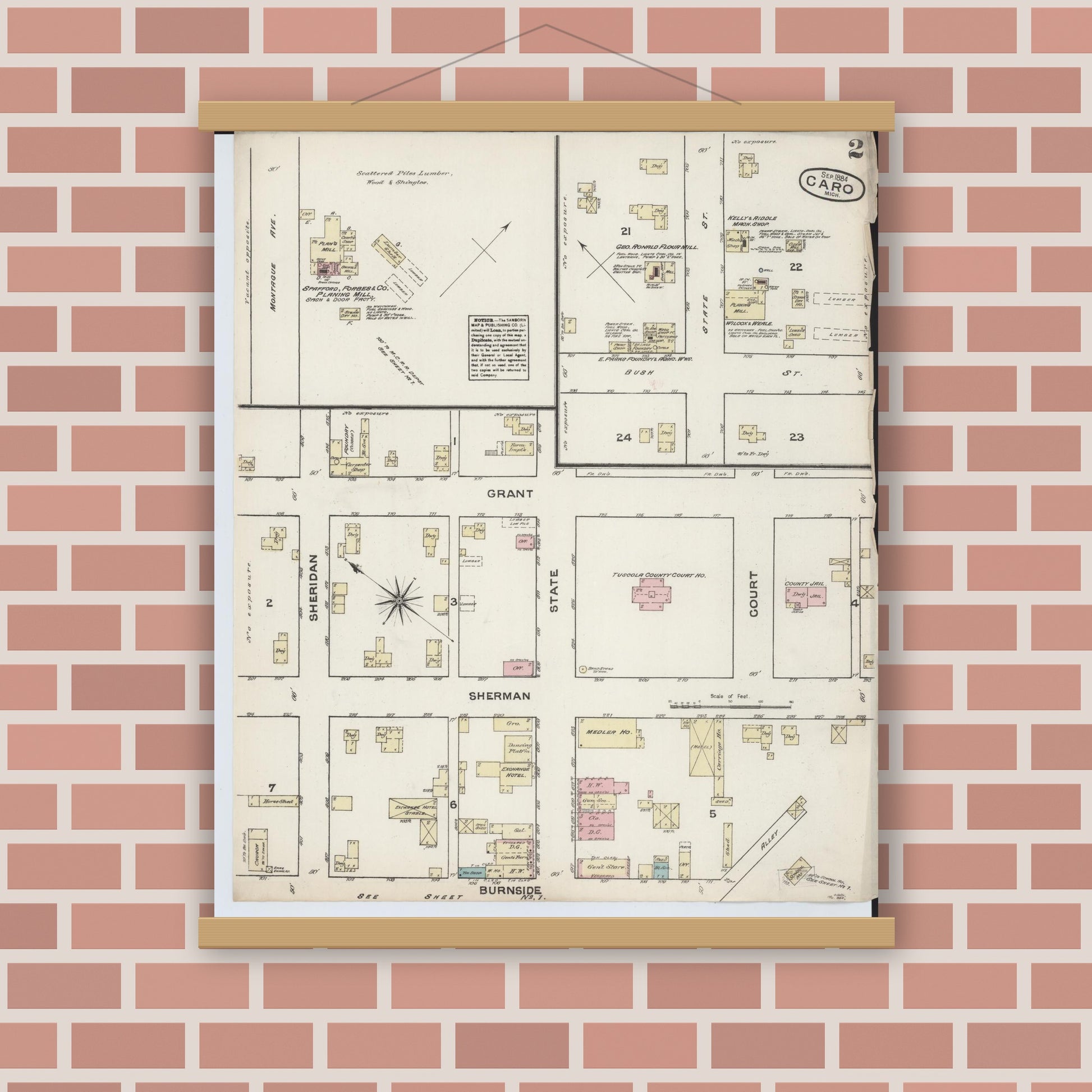 Old map wall art mockup — magnetic wood frame on brick wall — Sanborn Fire Insurance Map from Caro, Tuscola County, Michigan (1884), Sheet #0002