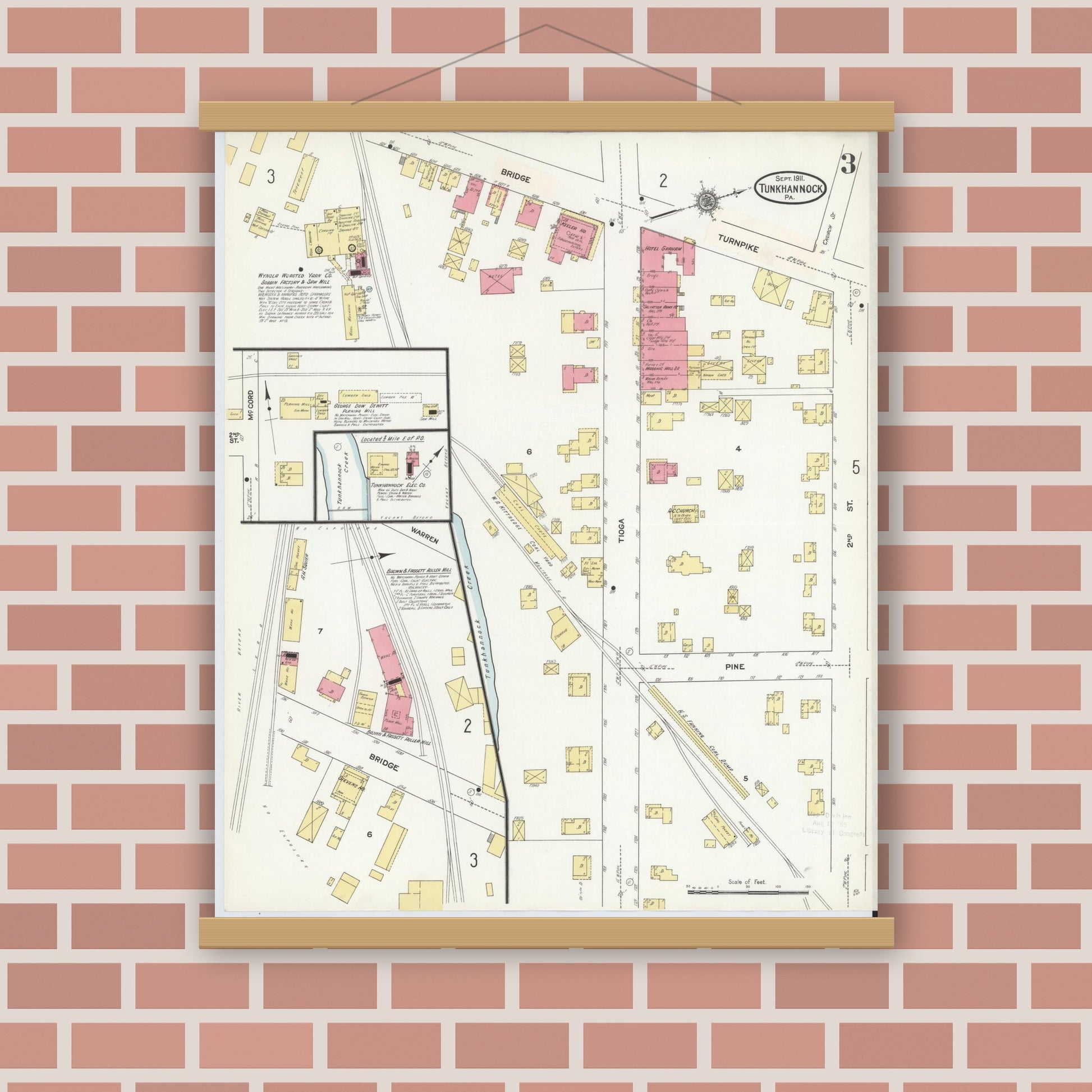 Old map wall art mockup — magnetic wood frame on brick wall — Sanborn Fire Insurance Map from Tunkhannock, Wyoming County, Pennsylvania (1911), Sheet #0003