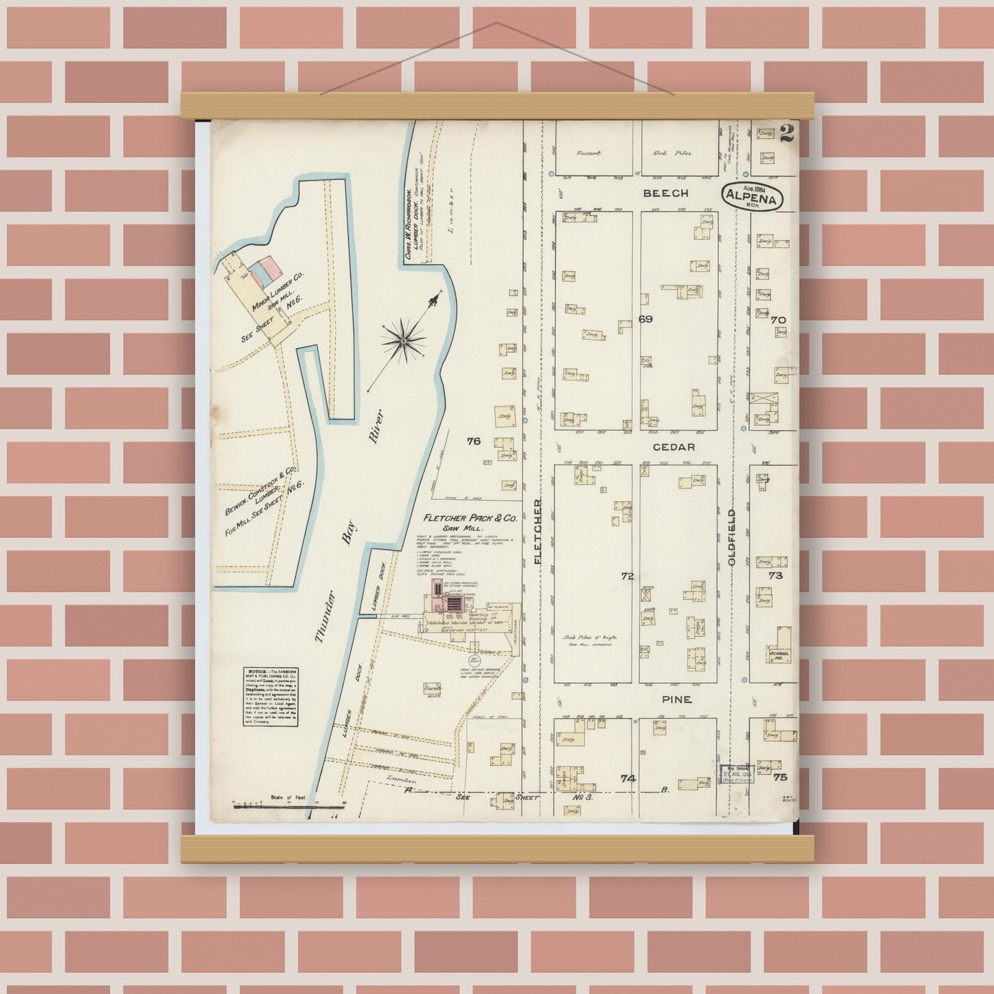 Old map wall art mockup — magnetic wood frame on brick wall — Sanborn Fire Insurance Map from Alpena, Alpena County, Michigan (1884), Sheet #0002