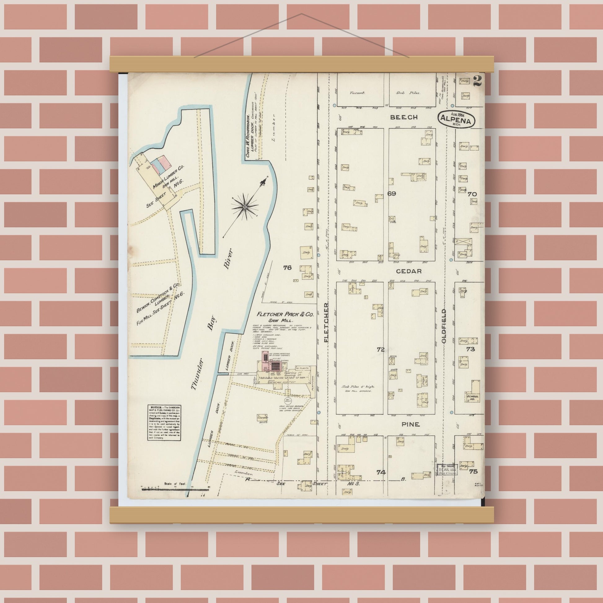 Old map wall art mockup — magnetic wood frame on brick wall — Sanborn Fire Insurance Map from Alpena, Alpena County, Michigan (1884), Sheet #0002