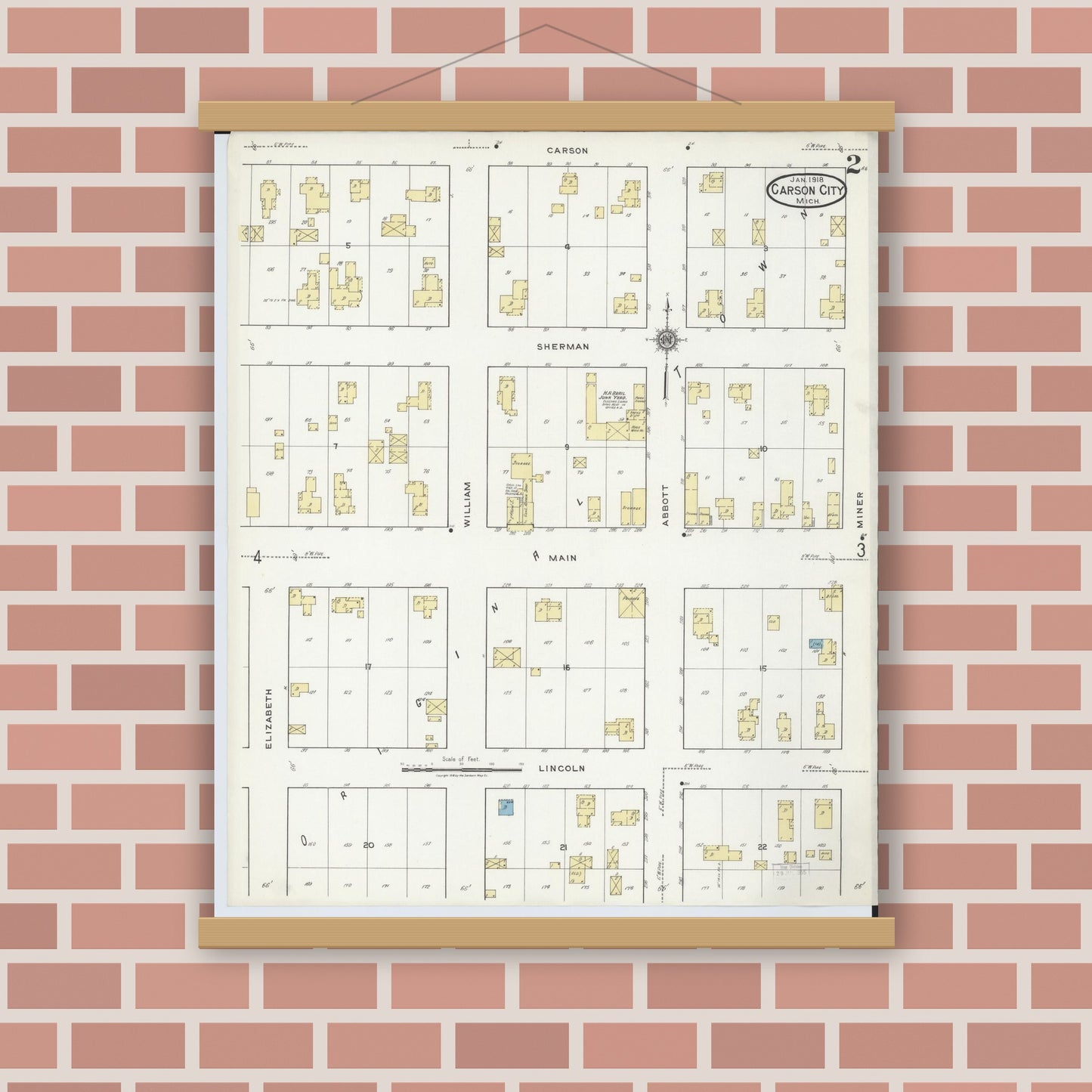 Old map wall art mockup — magnetic wood frame on brick wall — Sanborn Fire Insurance Map from Carson City, Montcalm County, Michigan (1918), Sheet #0002