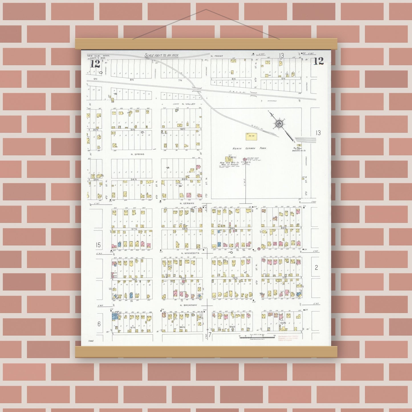 Old map wall art mockup — magnetic wood frame on brick wall — Sanborn Fire Insurance Map from New Ulm, Brown County, Minnesota (1935), Sheet #0012