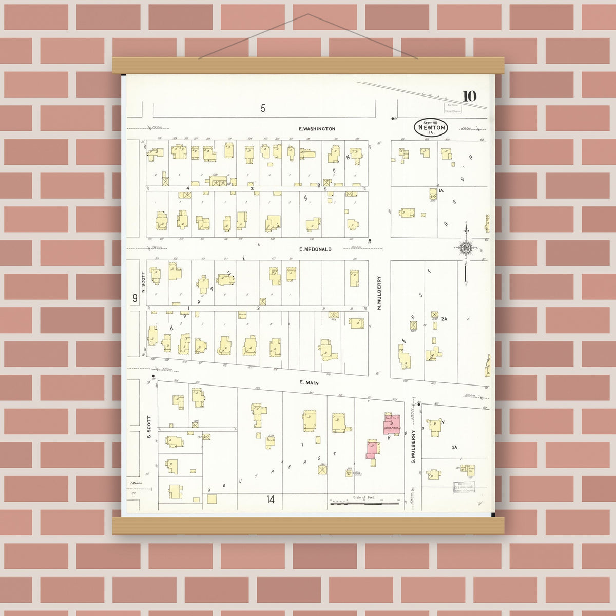 Old map wall art mockup — magnetic wood frame on brick wall — Sanborn Fire Insurance Map from Newton, Jasper County, Iowa (1911), Sheet #0010