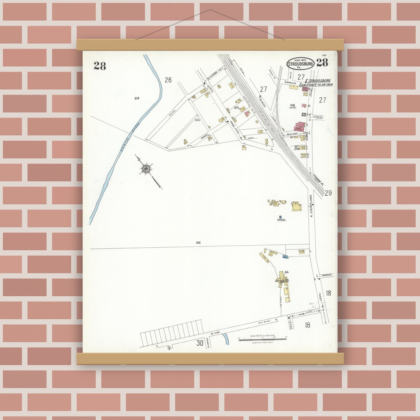Old map wall art mockup — magnetic wood frame on brick wall — Sanborn Fire Insurance Map from Stroudsburg, Monroe County, Pennsylvania (1923), Sheet #0028