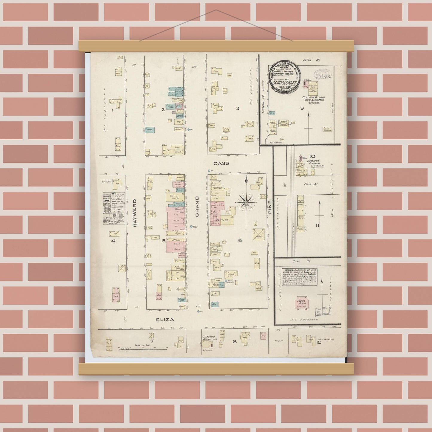 Old map wall art mockup — magnetic wood frame on brick wall — Sanborn Fire Insurance Map from Schoolcraft, Kalamazoo County, Michigan (1884), Sheet #0001