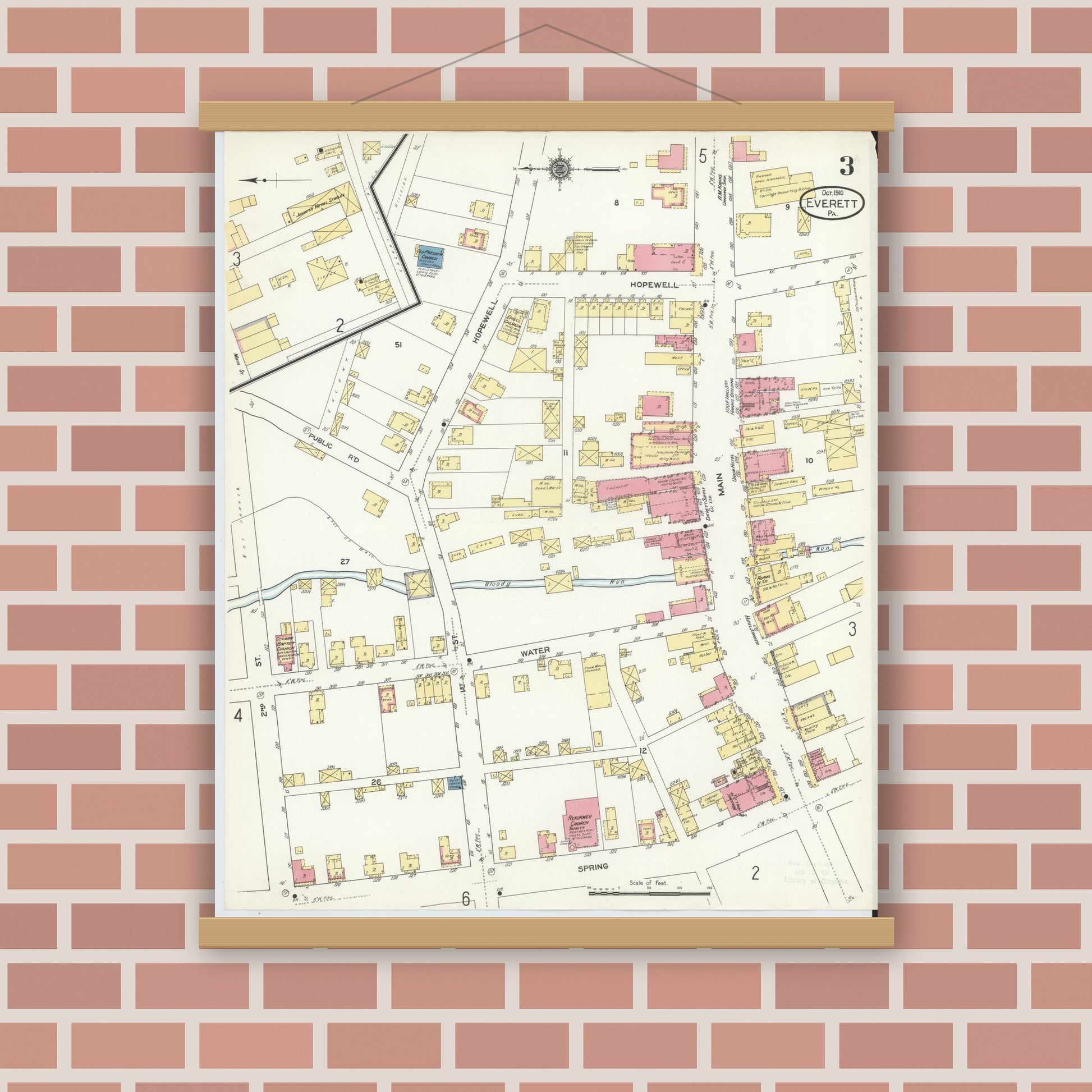 Old map wall art mockup — magnetic wood frame on brick wall — Sanborn Fire Insurance Map from Everett, Bedford County, Pennsylvania (1910), Sheet #0003