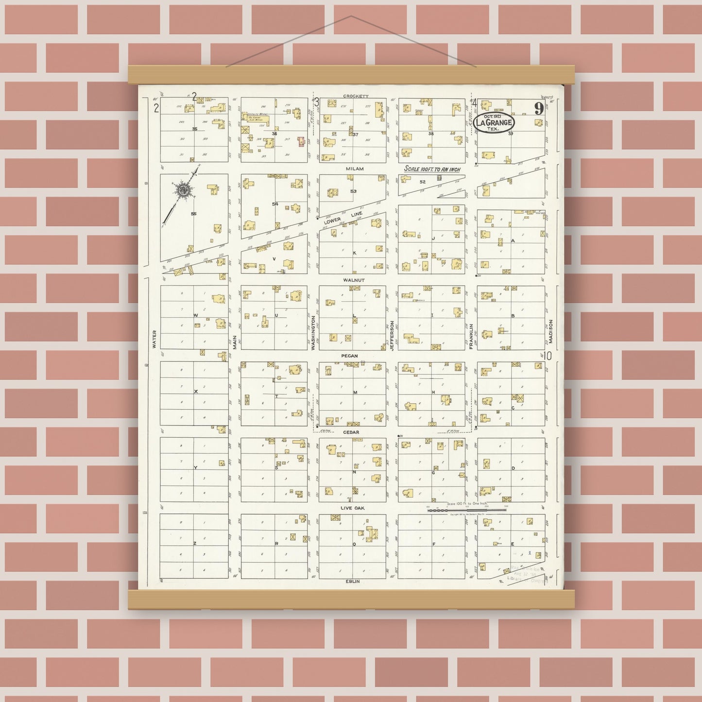 Old map wall art mockup — magnetic wood frame on brick wall — Sanborn Fire Insurance Map from La Grange, Fayette County, Texas (1921), Sheet #0009