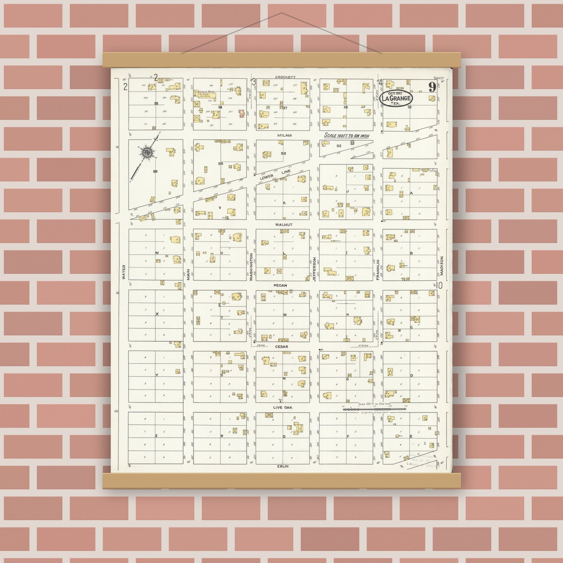 Old map wall art mockup — magnetic wood frame on brick wall — Sanborn Fire Insurance Map from La Grange, Fayette County, Texas (1921), Sheet #0009