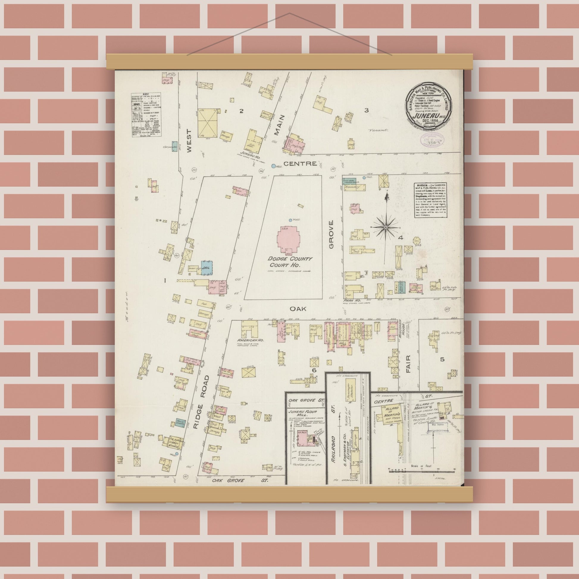 Old map wall art mockup — magnetic wood frame on brick wall — Sanborn Fire Insurance Map from Juneau, Dodge County, Wisconsin (1884), Sheet #0001