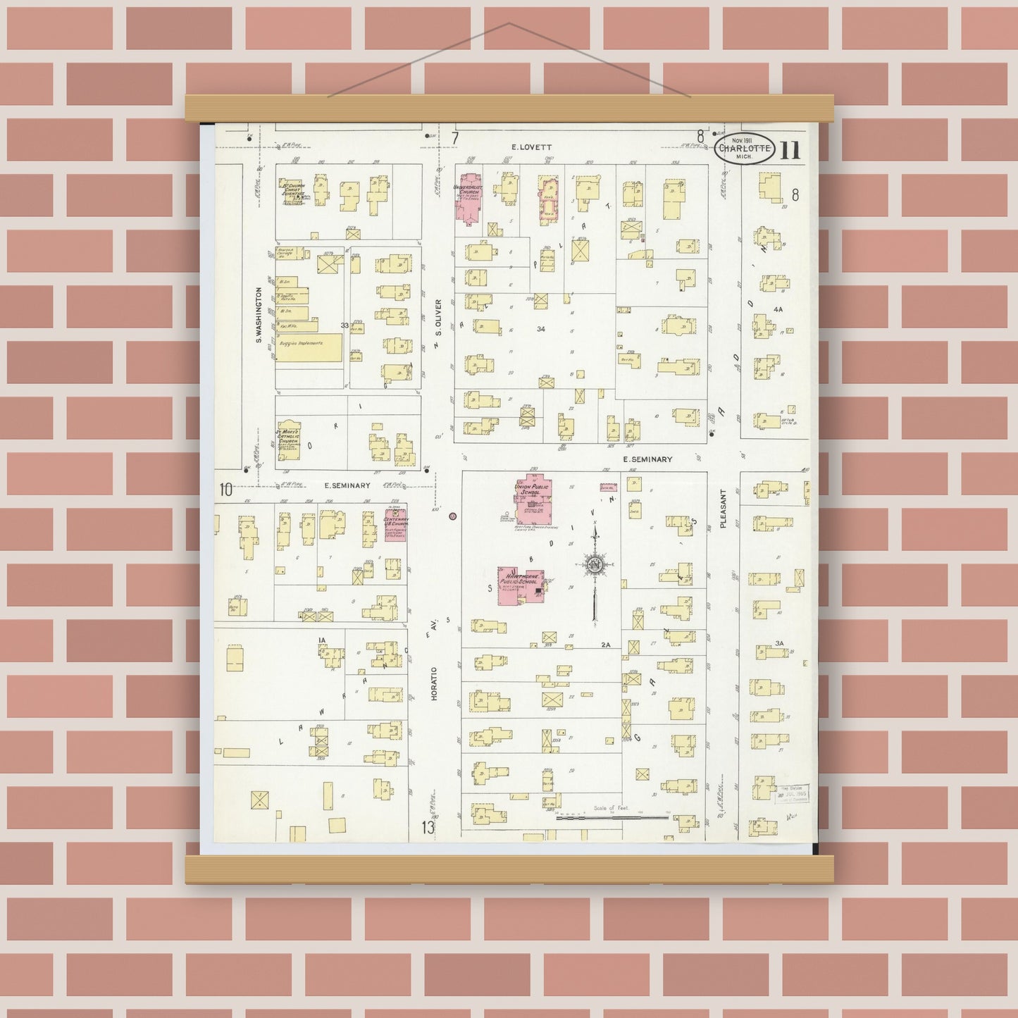 Old map wall art mockup — magnetic wood frame on brick wall — Sanborn Fire Insurance Map from Charlotte, Eaton County, Michigan (1911), Sheet #0011