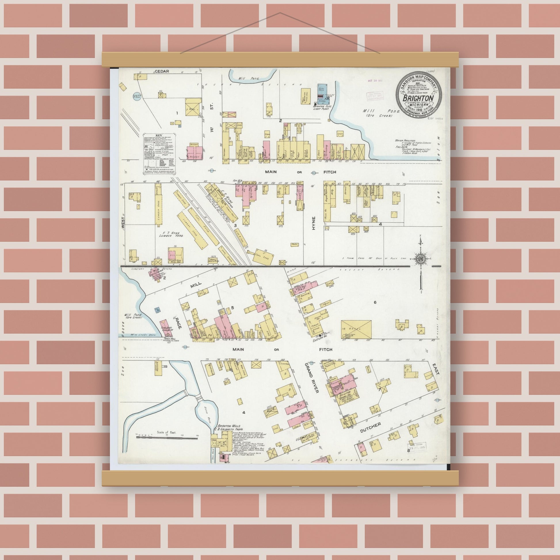 Old map wall art mockup — magnetic wood frame on brick wall — Sanborn Fire Insurance Map from Brighton, Livingston County, Michigan (1910), Sheet #0001