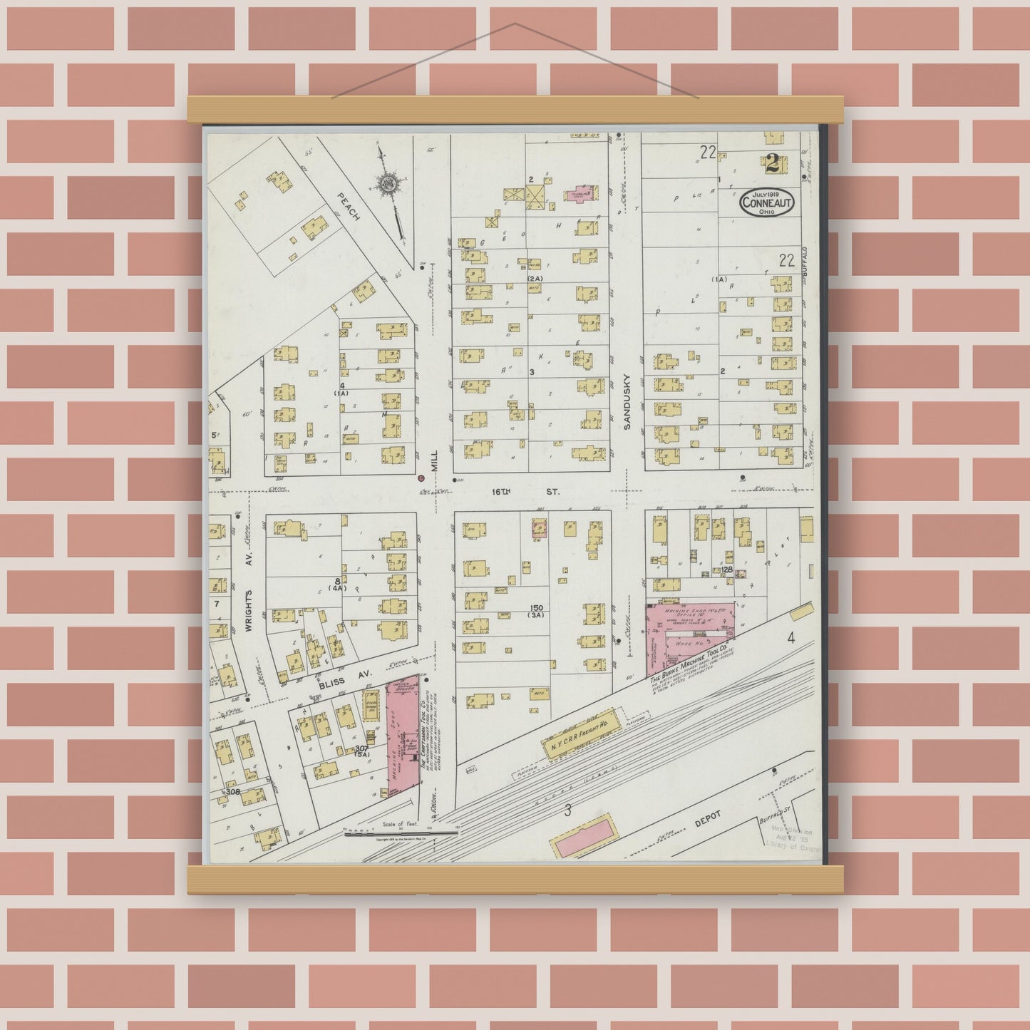 Old map wall art mockup — magnetic wood frame on brick wall — Sanborn Fire Insurance Map from Conneaut, Ashtabula County, Ohio (1919), Sheet #0002