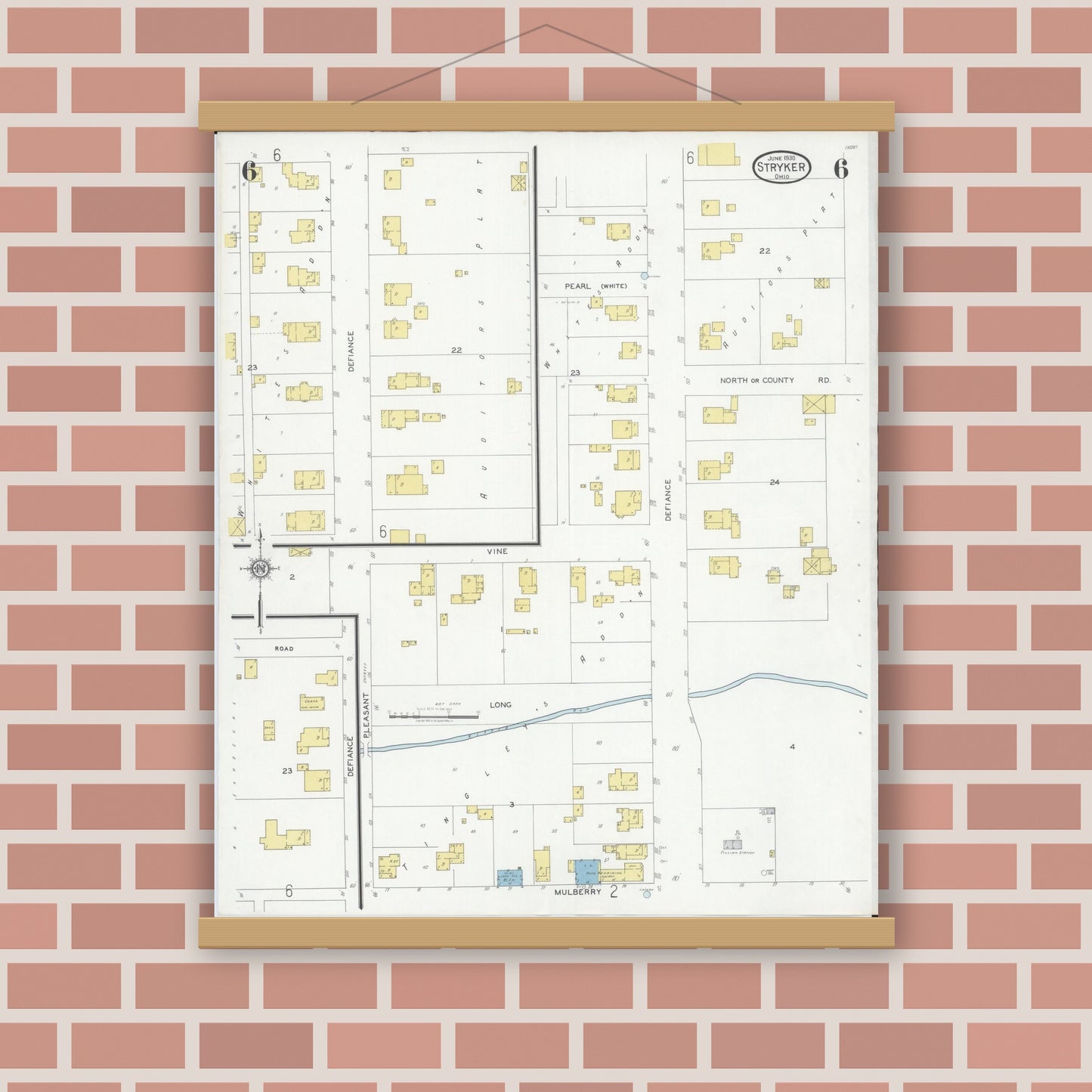 Old map wall art mockup — magnetic wood frame on brick wall — Sanborn Fire Insurance Map from Stryker, Williams County, Ohio (1930), Sheet #0006