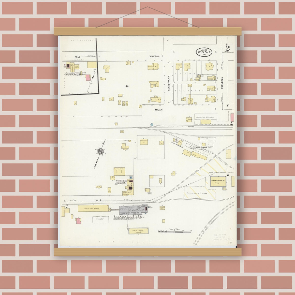 Old map wall art mockup — magnetic wood frame on brick wall — Sanborn Fire Insurance Map from Rockdale, Milam County, Texas (1912), Sheet #0002