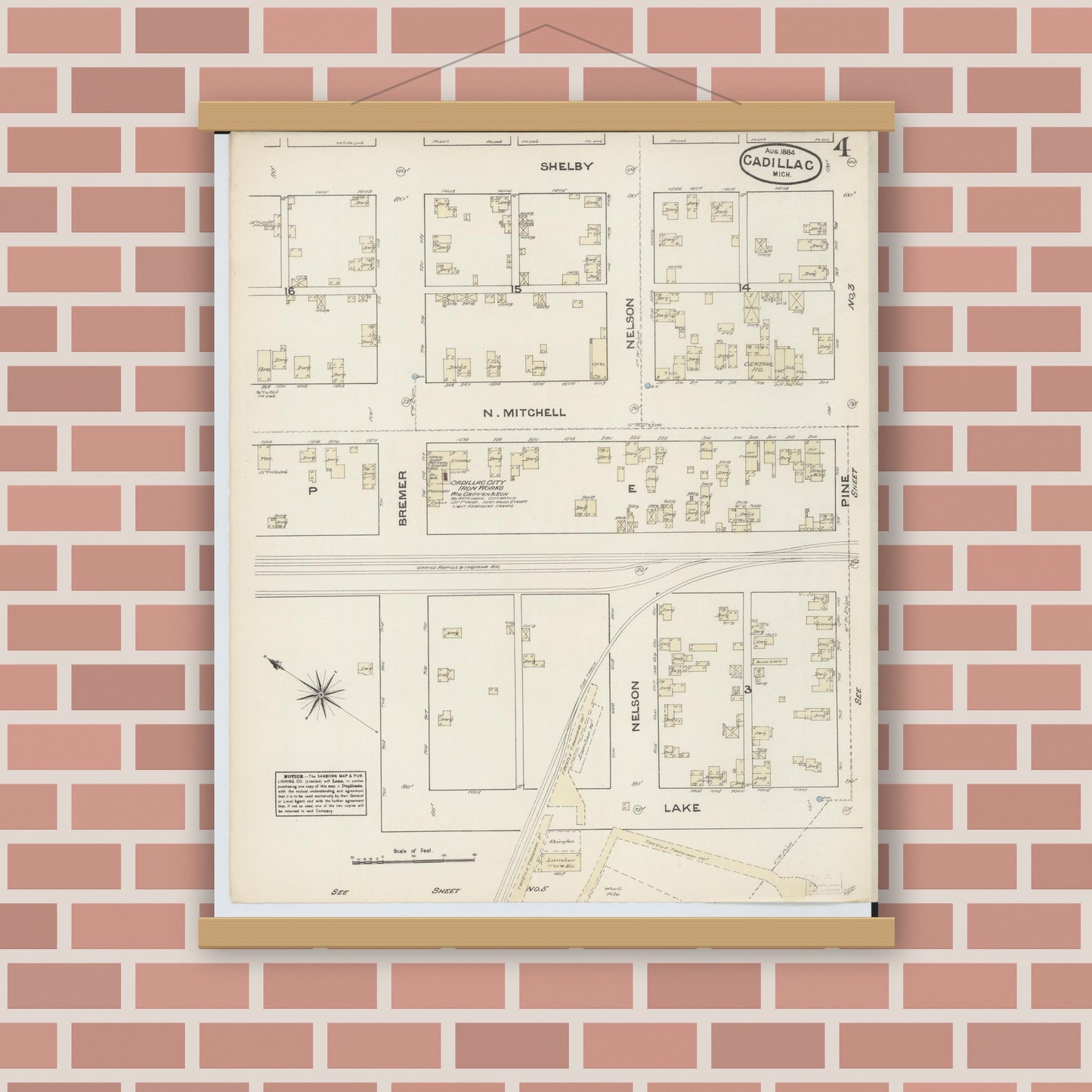 Old map wall art mockup — magnetic wood frame on brick wall — Sanborn Fire Insurance Map from Cadillac, Wexford County, Michigan (1884), Sheet #0004
