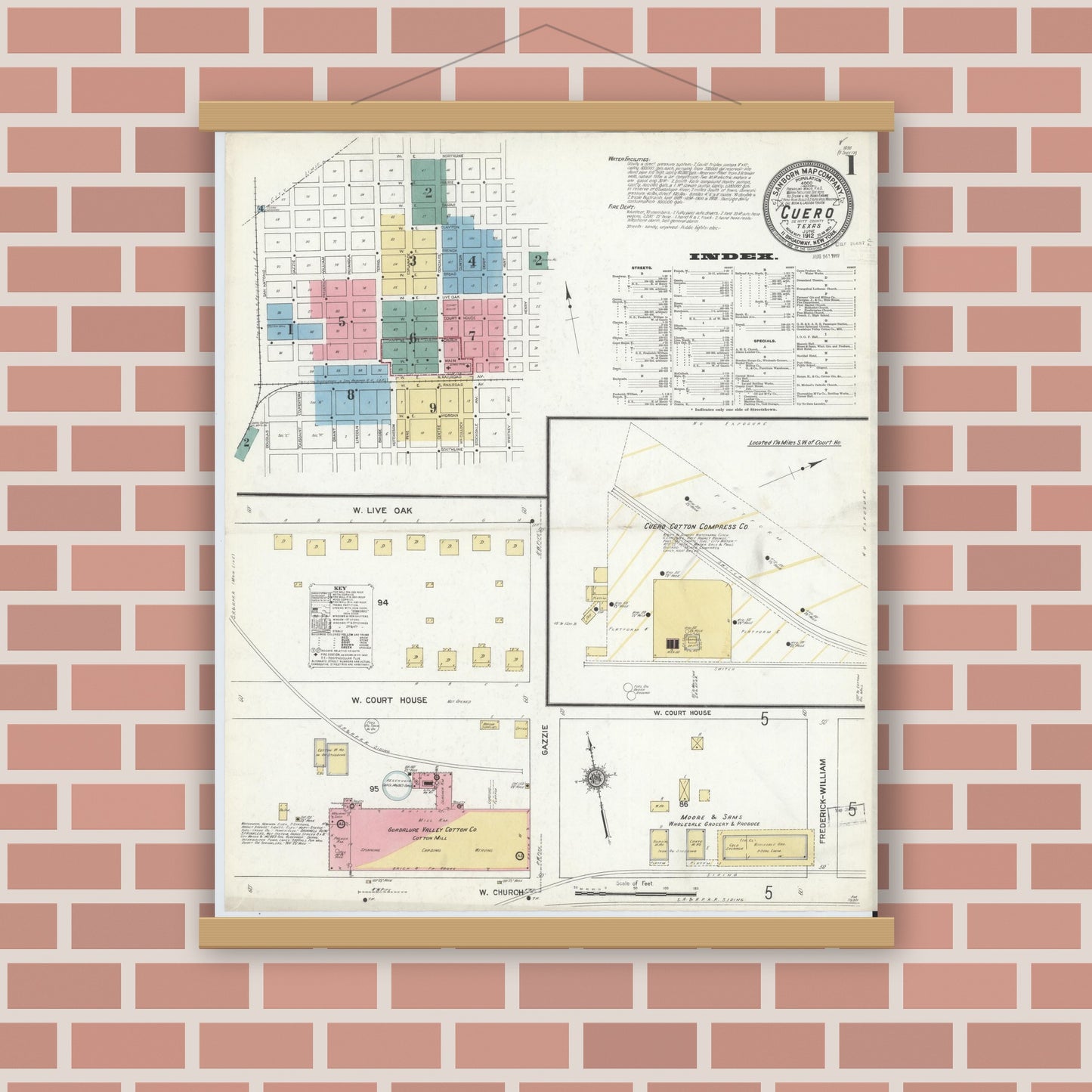 Old map wall art mockup — magnetic wood frame on brick wall — Sanborn Fire Insurance Map from Cuero, De Witt County, Texas (1912), Sheet #0001