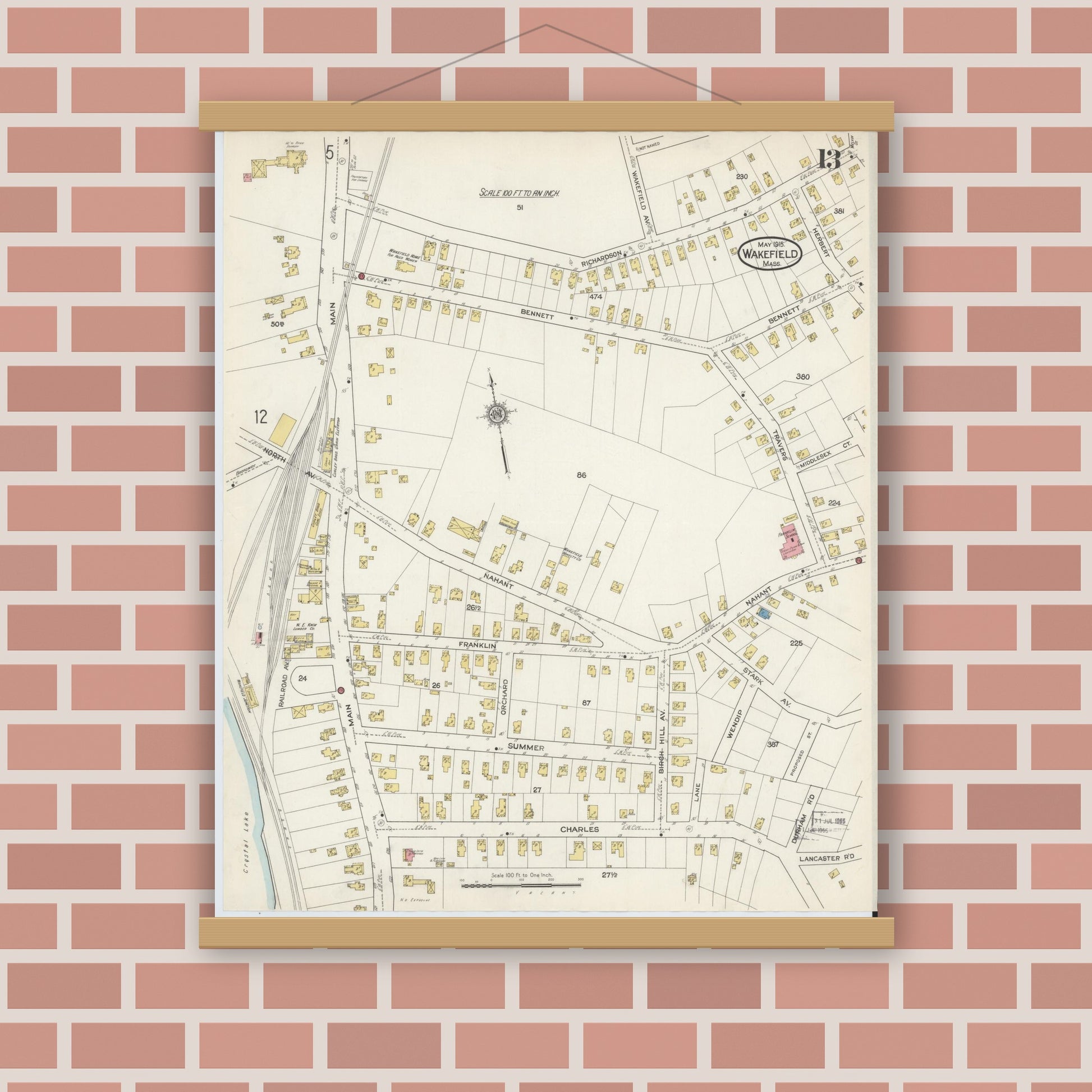 Old map wall art mockup — magnetic wood frame on brick wall — Sanborn Fire Insurance Map from Wakefield, Middlesex County, Massachusetts (1915), Sheet #0013