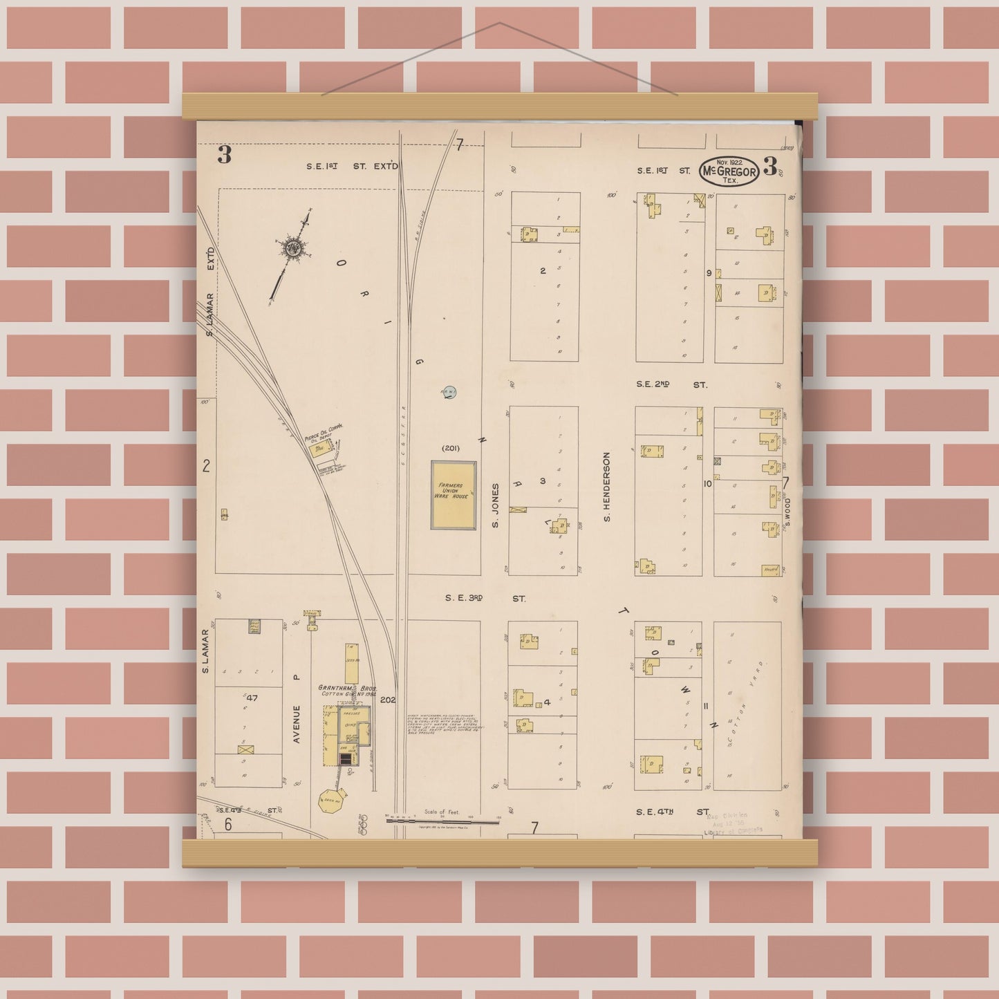 Old map wall art mockup — magnetic wood frame on brick wall — Sanborn Fire Insurance Map from McGregor, McLennan County, Texas (1922), Sheet #0003