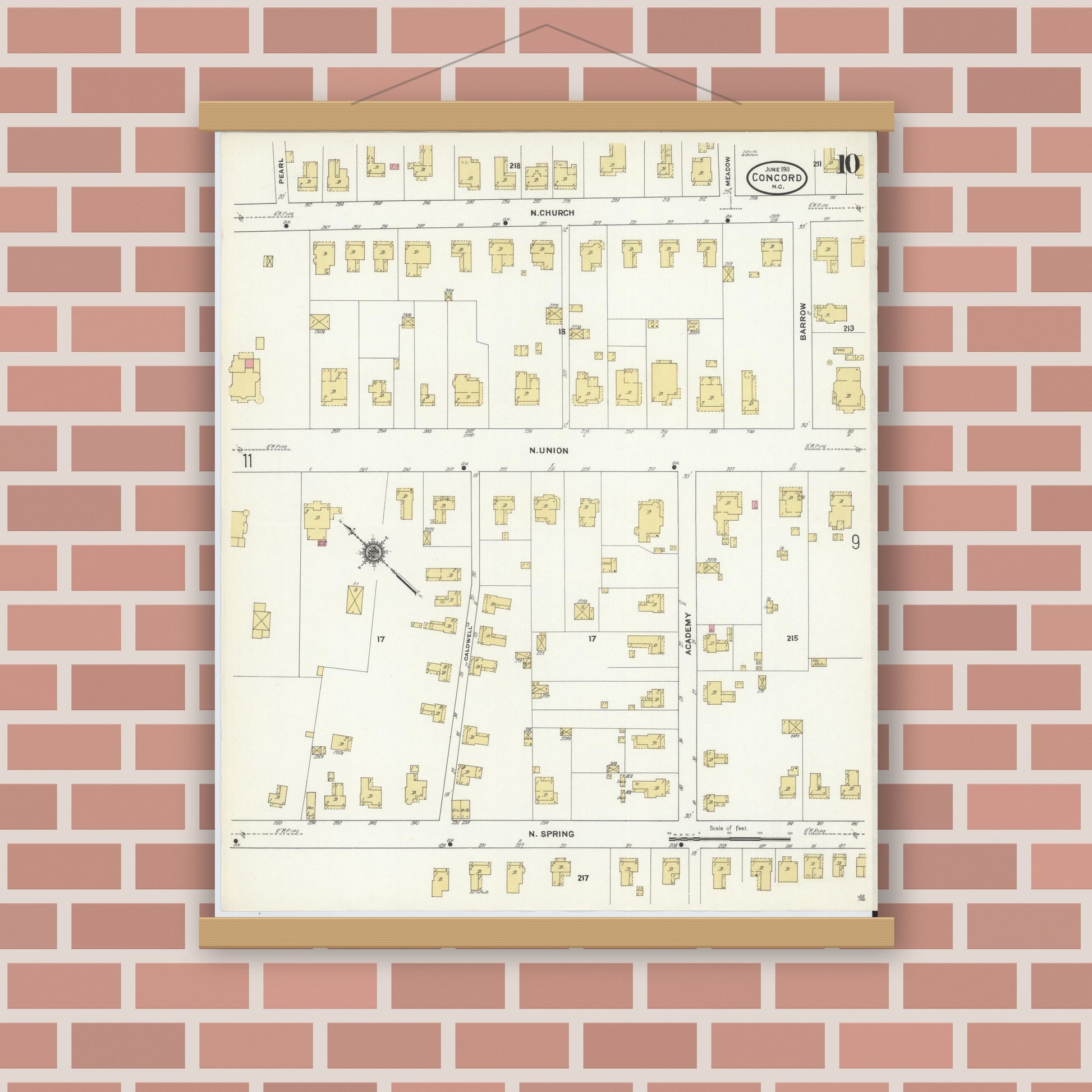 Old map wall art mockup — magnetic wood frame on brick wall — Sanborn Fire Insurance Map from Concord, Cabarrus County, North Carolina (1911), Sheet #0010