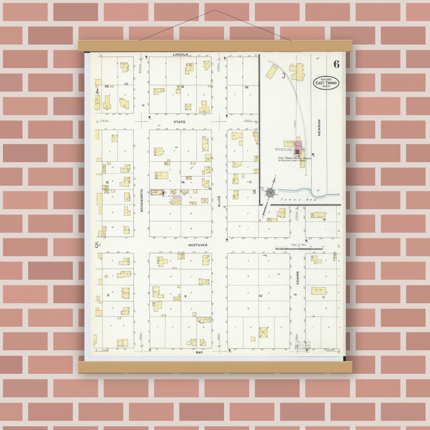 Old map wall art mockup — magnetic wood frame on brick wall — Sanborn Fire Insurance Map from East Tawas, Iosco County, Michigan (1910), Sheet #0006