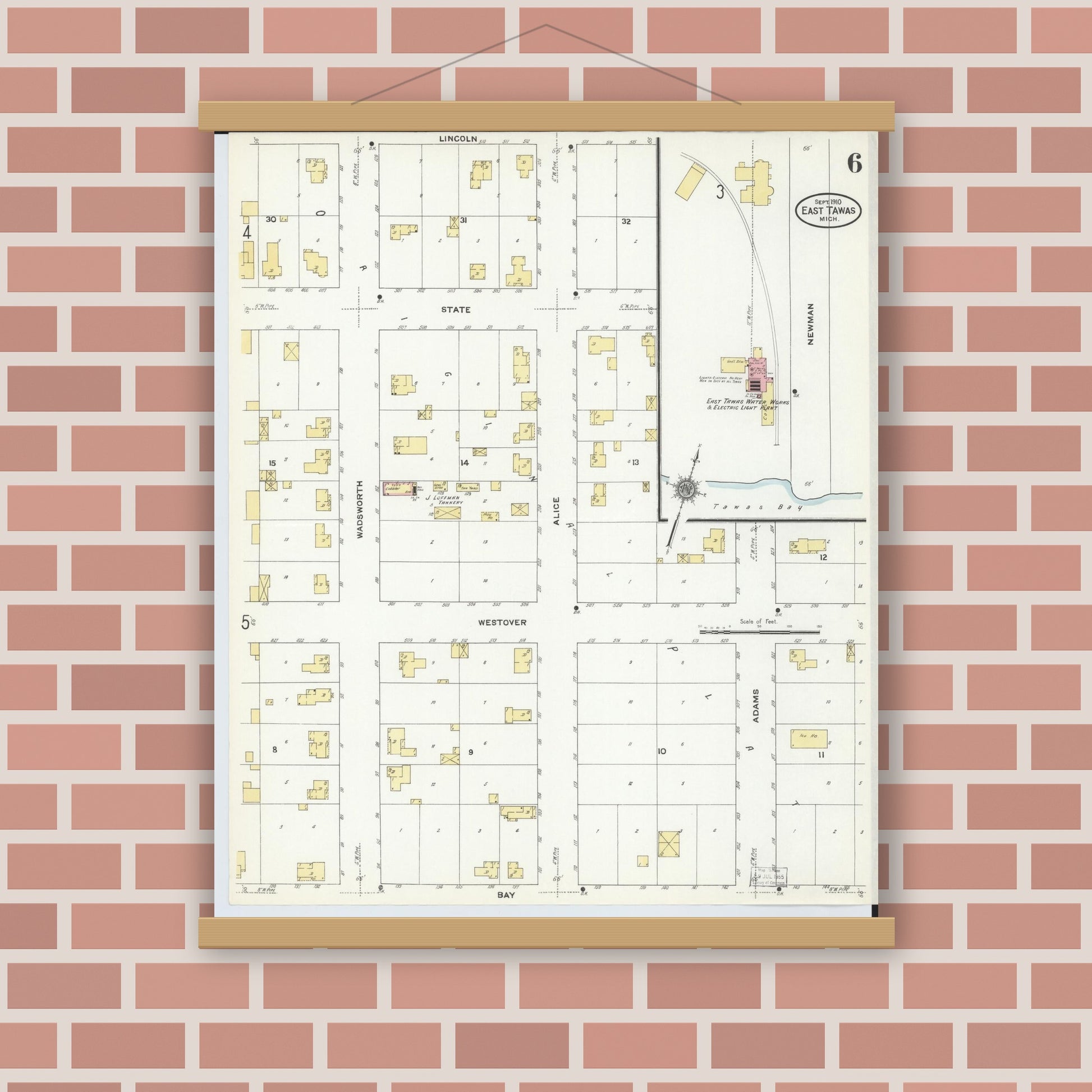 Old map wall art mockup — magnetic wood frame on brick wall — Sanborn Fire Insurance Map from East Tawas, Iosco County, Michigan (1910), Sheet #0006