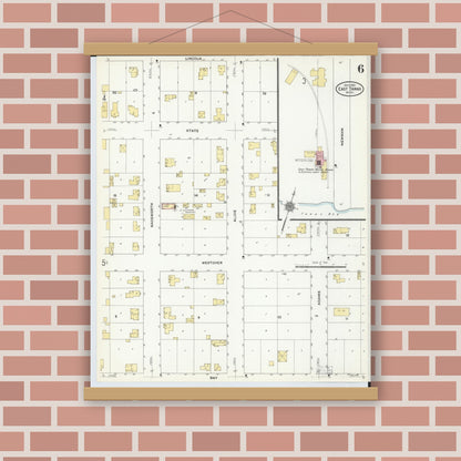 Old map wall art mockup — magnetic wood frame on brick wall — Sanborn Fire Insurance Map from East Tawas, Iosco County, Michigan (1910), Sheet #0006