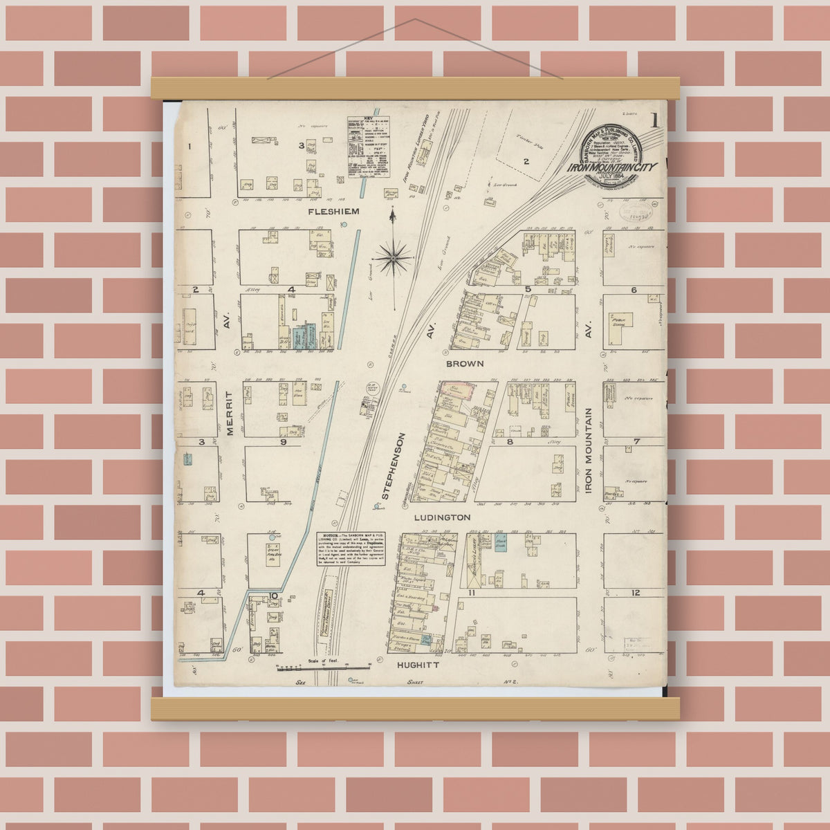 Old map wall art mockup — magnetic wood frame on brick wall — Sanborn Fire Insurance Map from Iron Mountain, Dickinson County, Michigan (1884), Sheet #0001