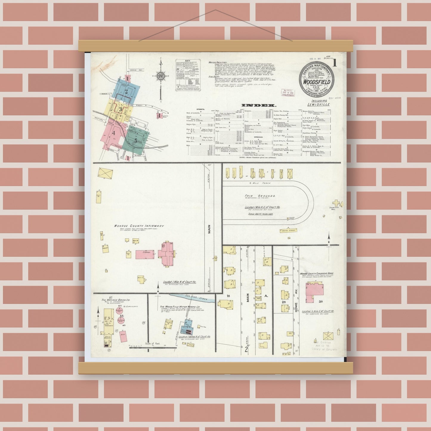 Old map wall art mockup — magnetic wood frame on brick wall — Sanborn Fire Insurance Map from Woodsfield, Monroe County, Ohio (1911), Sheet #0001