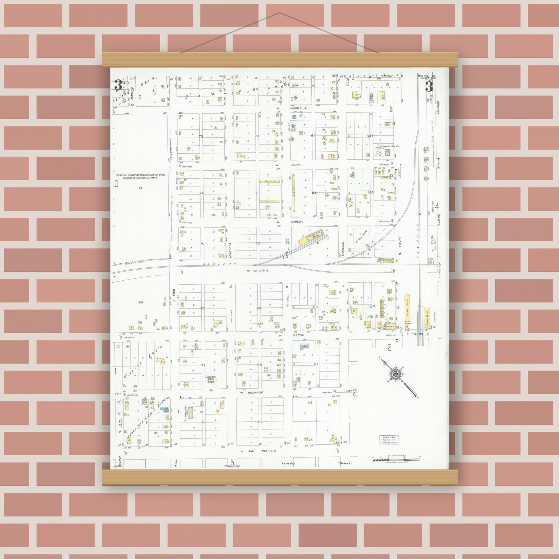 Old map wall art mockup — magnetic wood frame on brick wall — Sanborn Fire Insurance Map from Mathis, San Patricio County, Texas (1950), Sheet #0003
