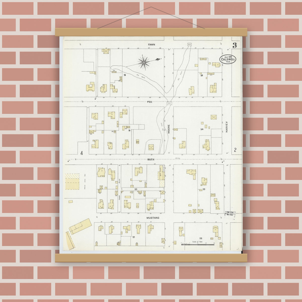Old map wall art mockup — magnetic wood frame on brick wall — Sanborn Fire Insurance Map from Caldwell, Burleson County, Texas (1906), Sheet #0003