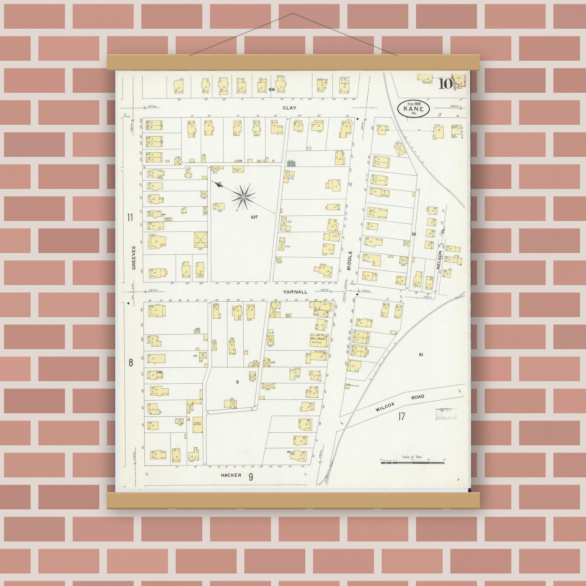 Old map wall art mockup — magnetic wood frame on brick wall — Sanborn Fire Insurance Map from Kane, McKean County, Pennsylvania (1909), Sheet #0010