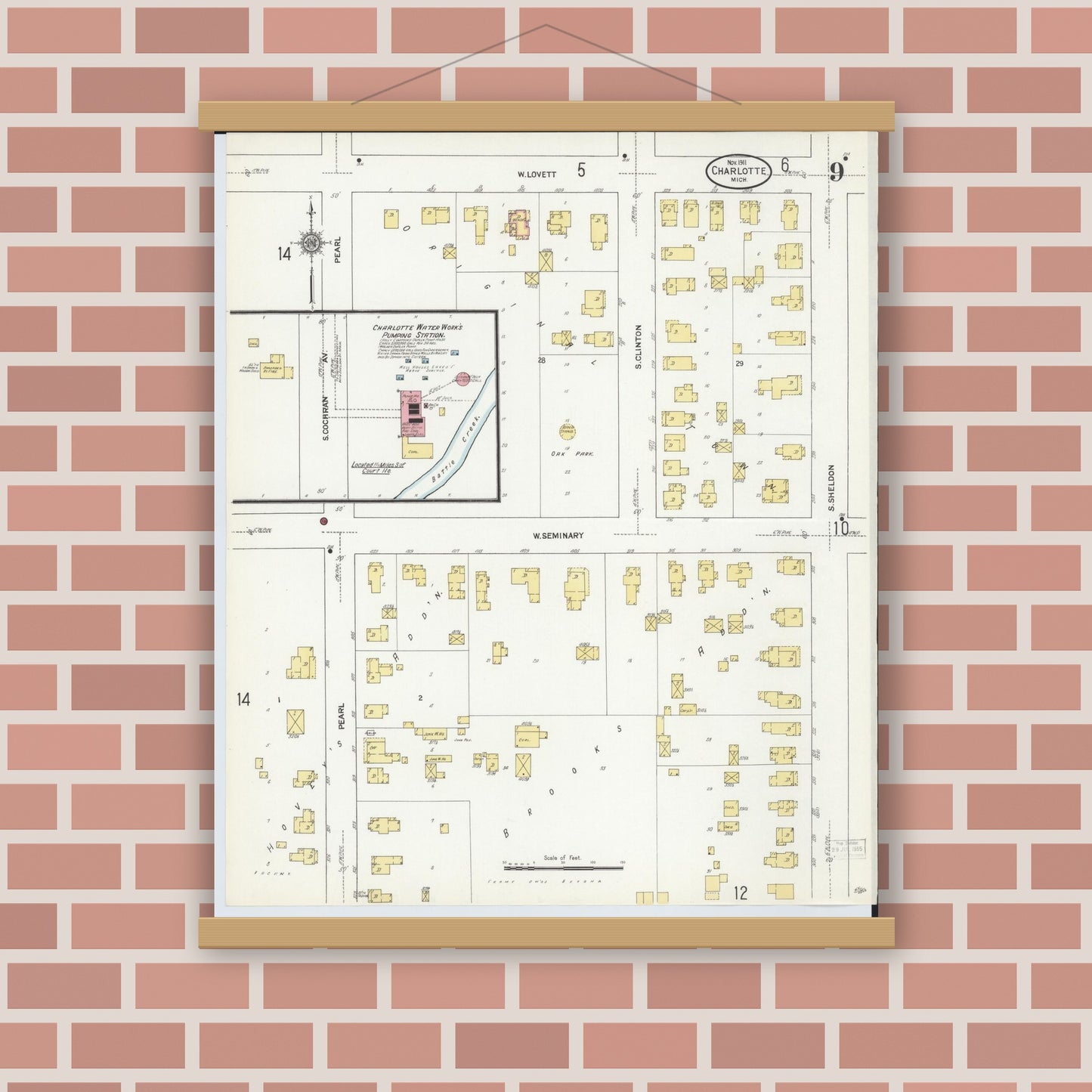 Old map wall art mockup — magnetic wood frame on brick wall — Sanborn Fire Insurance Map from Charlotte, Eaton County, Michigan (1911), Sheet #0009