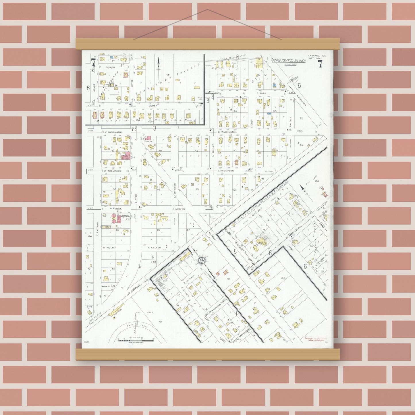 Old map wall art mockup — magnetic wood frame on brick wall — Sanborn Fire Insurance Map from Harvard, McHenry County, Illinois (1934), Sheet #0007
