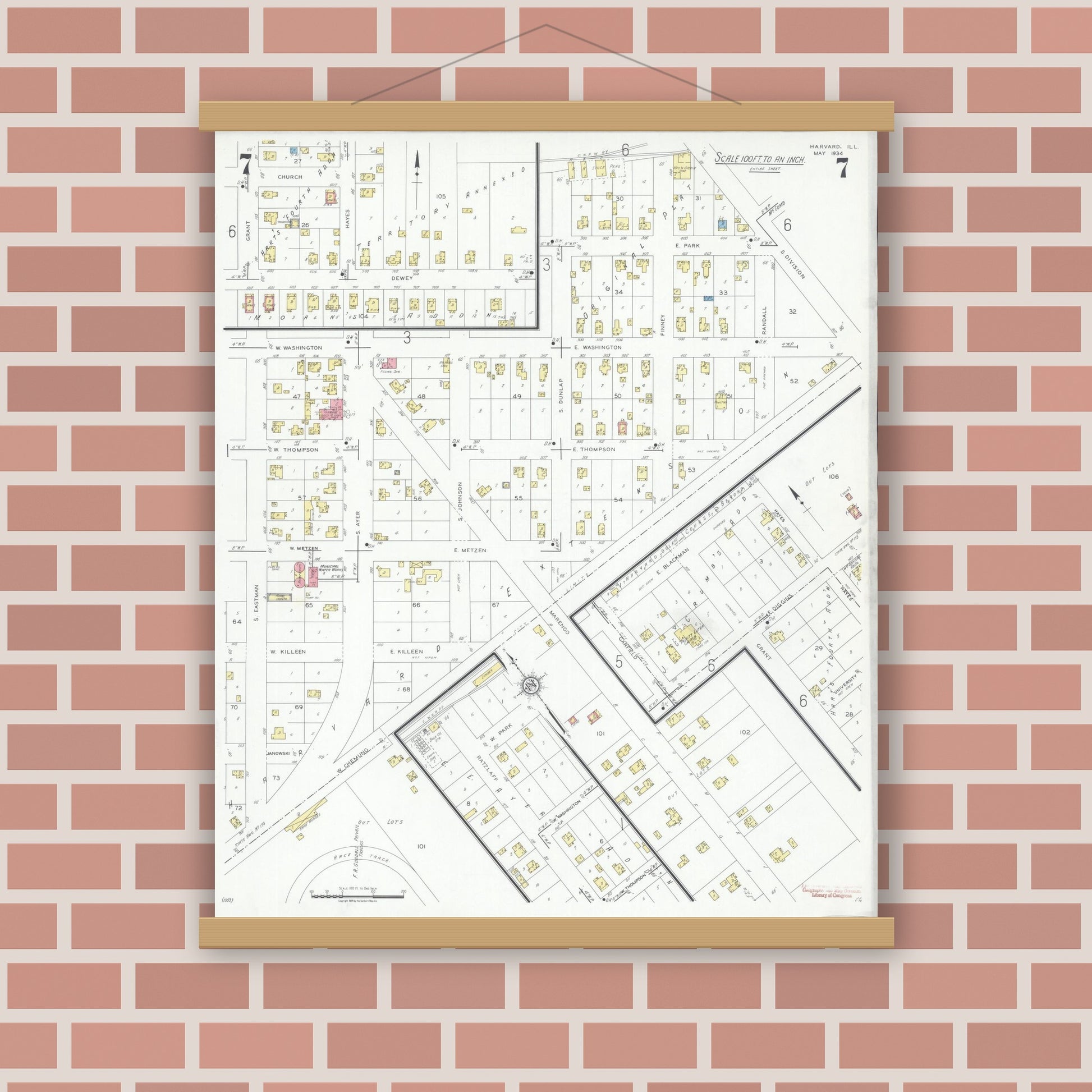 Old map wall art mockup — magnetic wood frame on brick wall — Sanborn Fire Insurance Map from Harvard, McHenry County, Illinois (1934), Sheet #0007