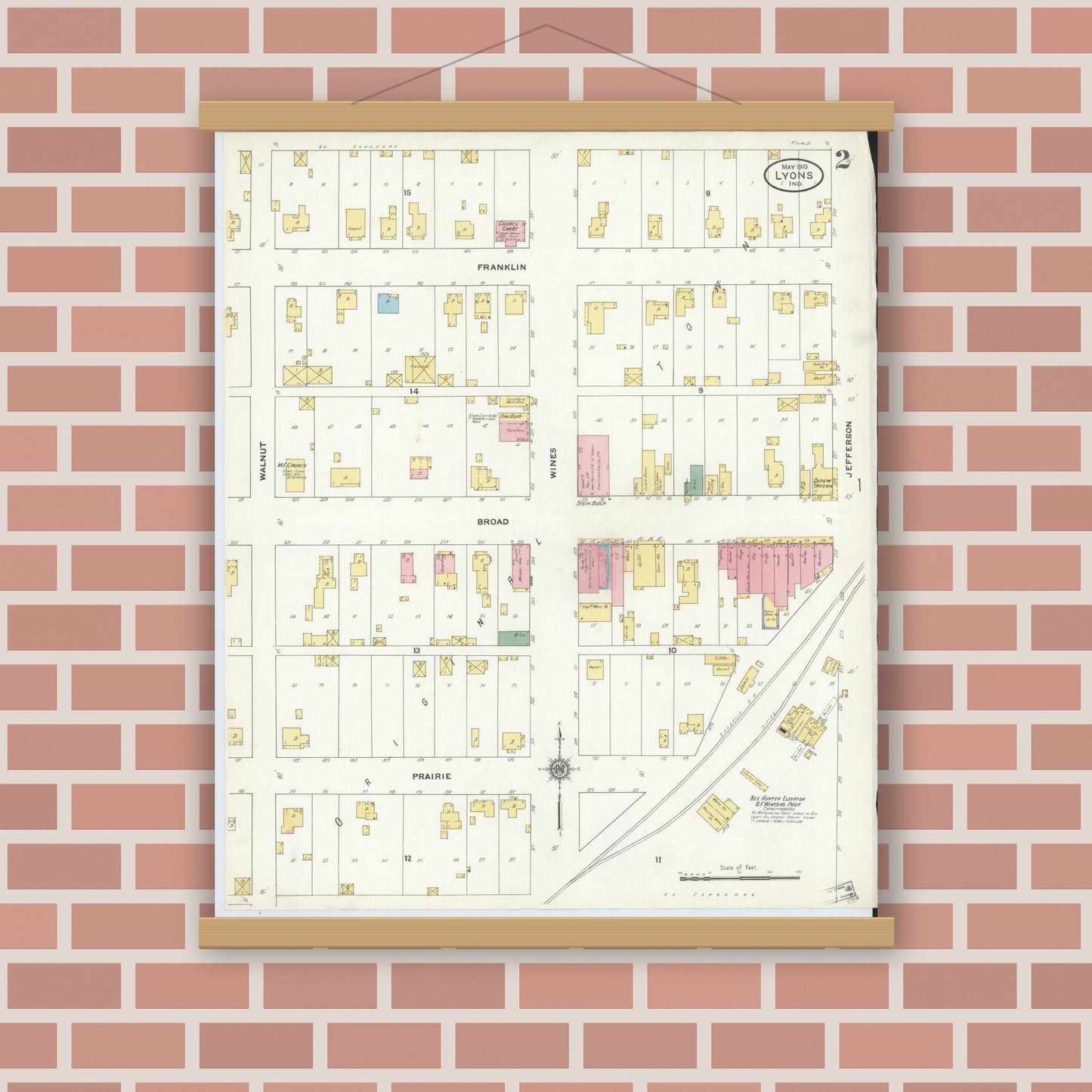 Old map wall art mockup — magnetic wood frame on brick wall — Sanborn Fire Insurance Map from Lyons, Greene County, Indiana (1910), Sheet #0002