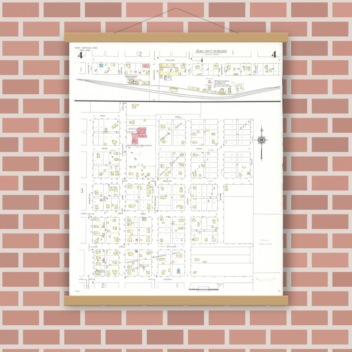 Old map wall art mockup — magnetic wood frame on brick wall — Sanborn Fire Insurance Map from Nora Springs, Floyd County, Iowa (1942), Sheet #0004