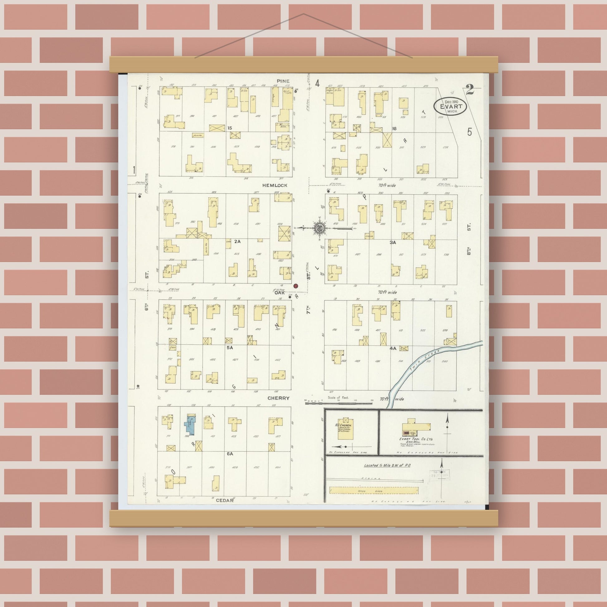Old map wall art mockup — magnetic wood frame on brick wall — Sanborn Fire Insurance Map from Evart, Osceola County, Michigan (1910), Sheet #0002
