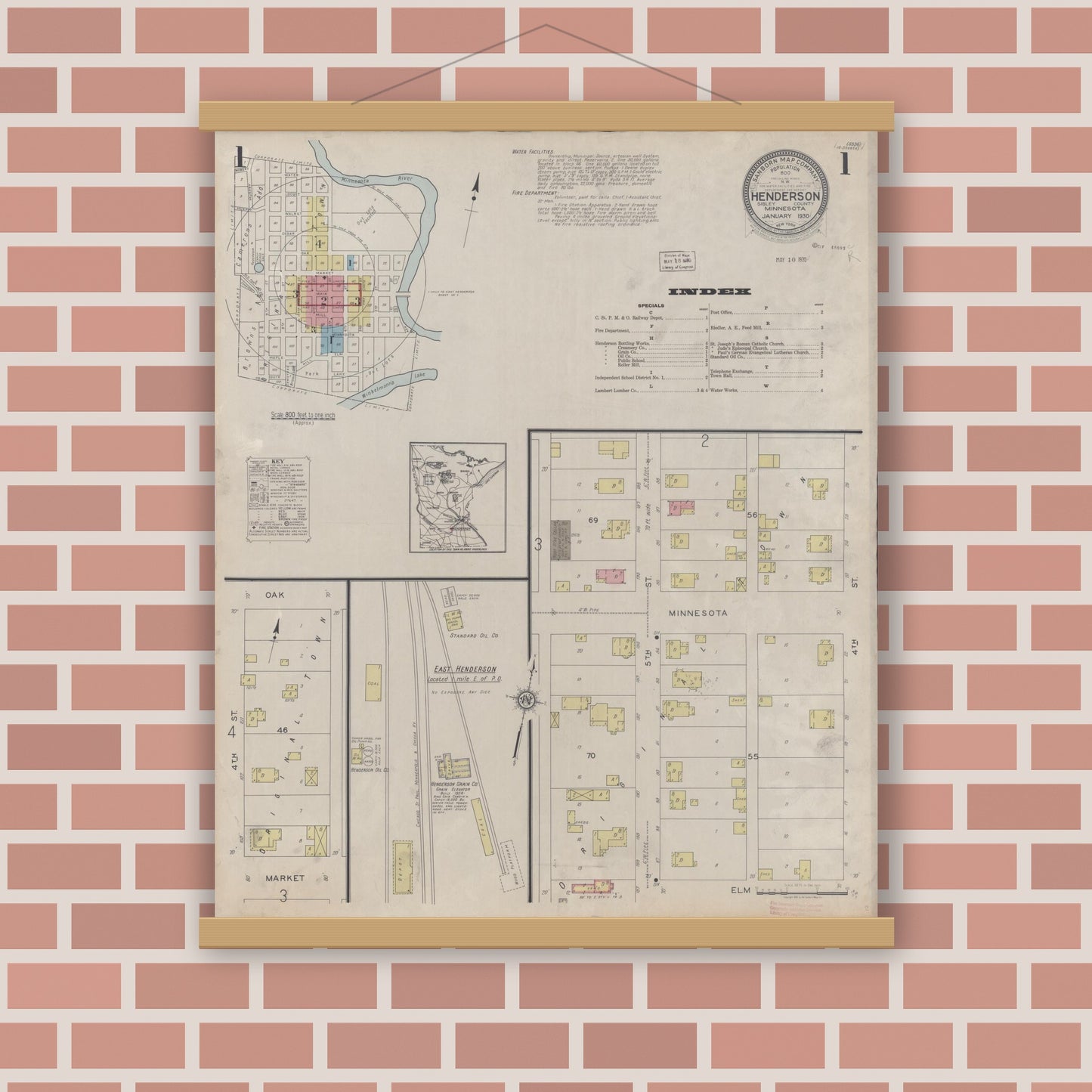 Old map wall art mockup — magnetic wood frame on brick wall — Sanborn Fire Insurance Map from Henderson, Sibley County, Minnesota (1930), Sheet #0001