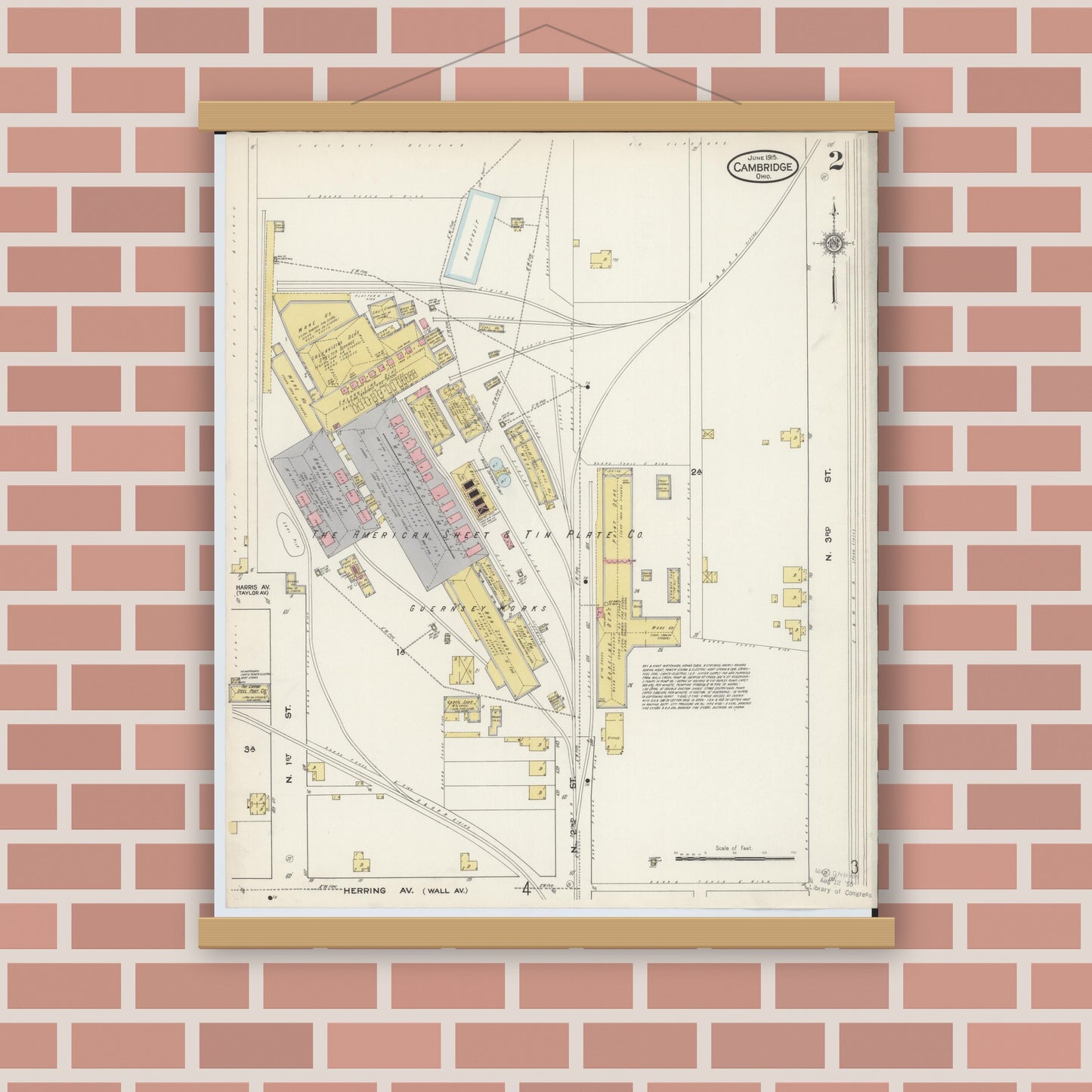 Old map wall art mockup — magnetic wood frame on brick wall — Sanborn Fire Insurance Map from Cambridge, Guernsey County, Ohio (1915), Sheet #0002
