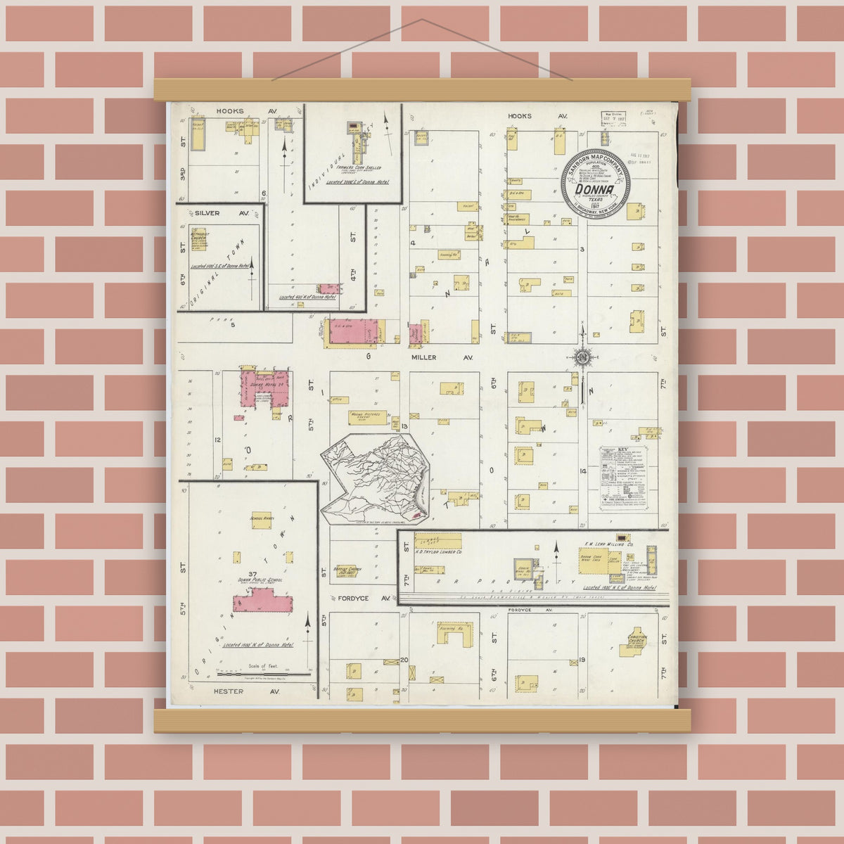Old map wall art mockup — magnetic wood frame on brick wall — Sanborn Fire Insurance Map from Donna, Hidalgo County, Texas (1917), Sheet #0001