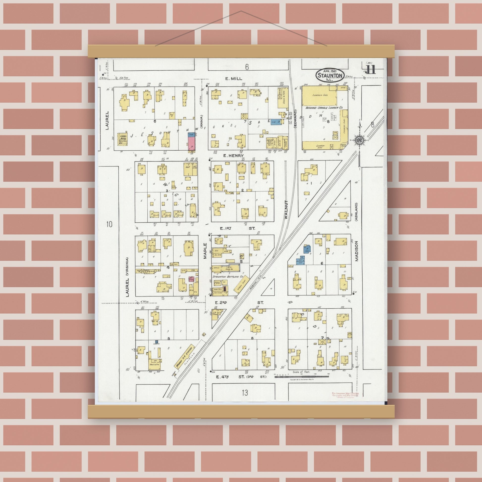Old map wall art mockup — magnetic wood frame on brick wall — Sanborn Fire Insurance Map from Staunton, Macoupin County, Illinois (1921), Sheet #0011