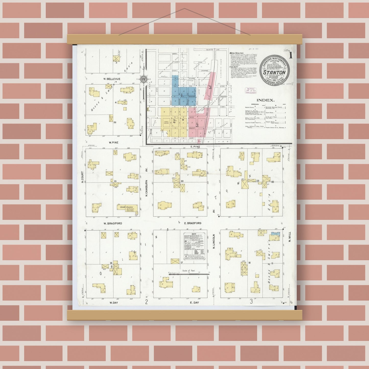 Old map wall art mockup — magnetic wood frame on brick wall — Sanborn Fire Insurance Map from Stanton, Montcalm County, Michigan (1911) - Complete Map Set