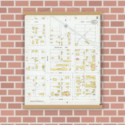 Old map wall art mockup — magnetic wood frame on brick wall — Sanborn Fire Insurance Map from Wells, Faribault County, Minnesota (1900), Sheet #0002