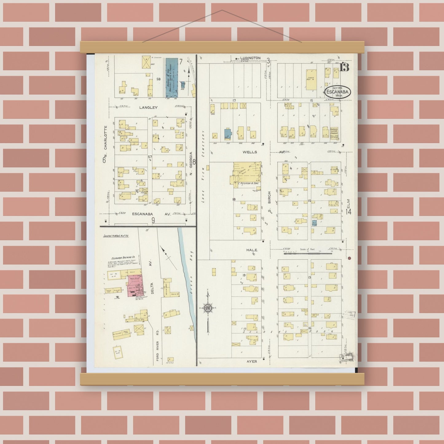 Old map wall art mockup — magnetic wood frame on brick wall — Sanborn Fire Insurance Map from Escanaba, Delta County, Michigan (1913), Sheet #0013