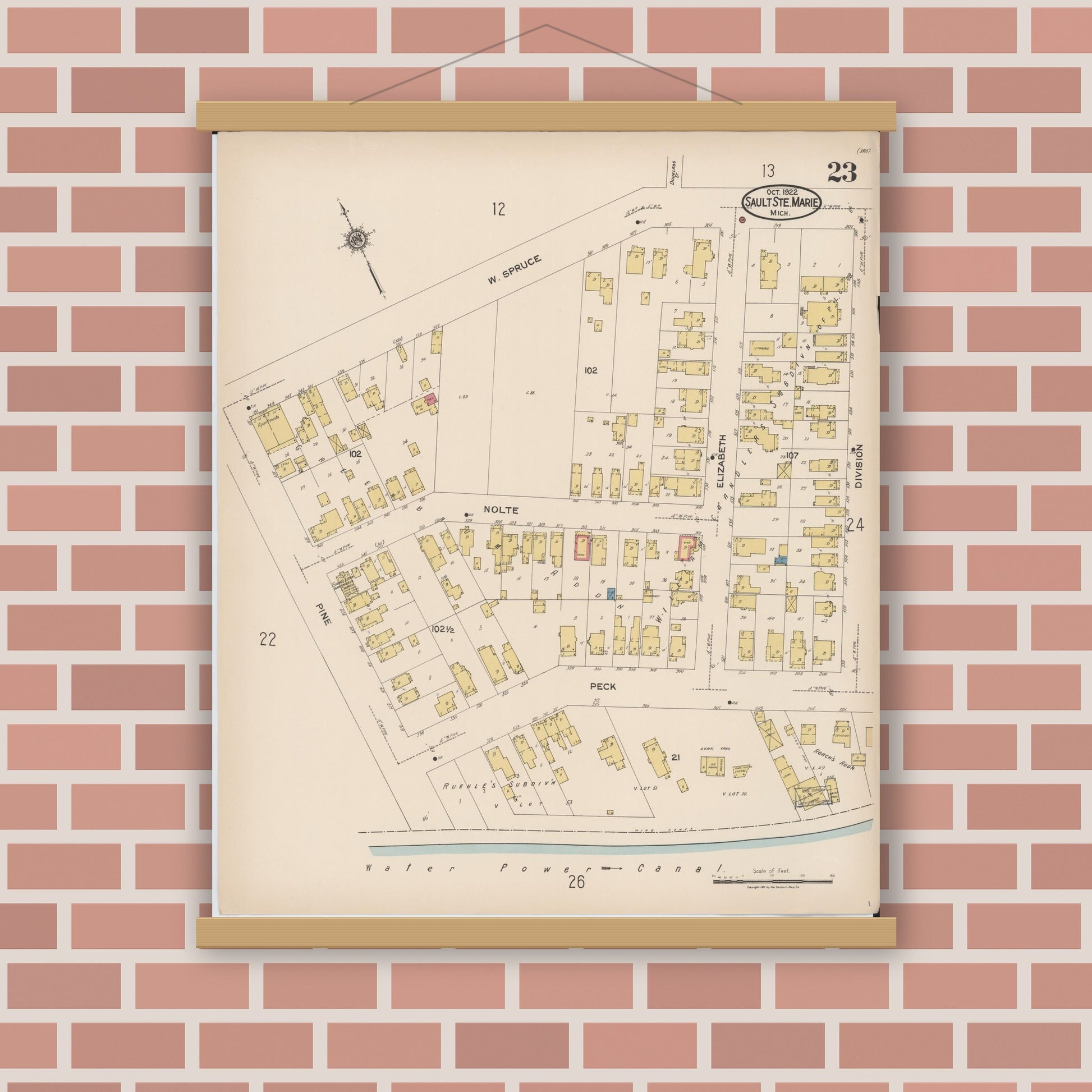 Old map wall art mockup — magnetic wood frame on brick wall — Sanborn Fire Insurance Map from Sault Sainte Marie, Chippewa County, Michigan (1922), Sheet #0023