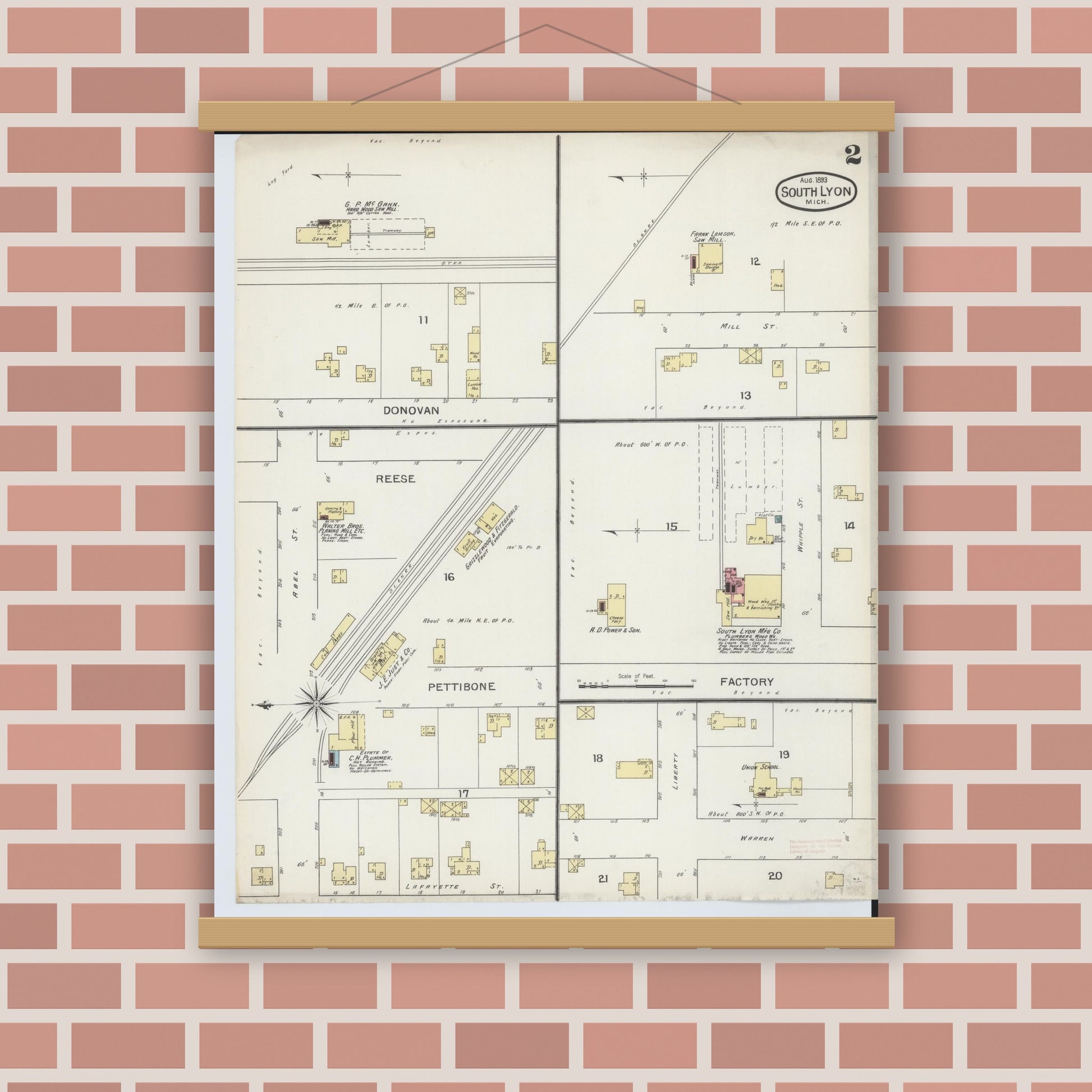 Old map wall art mockup — magnetic wood frame on brick wall — Sanborn Fire Insurance Map from South Lyon, Oakland County, Michigan (1893), Sheet #0002