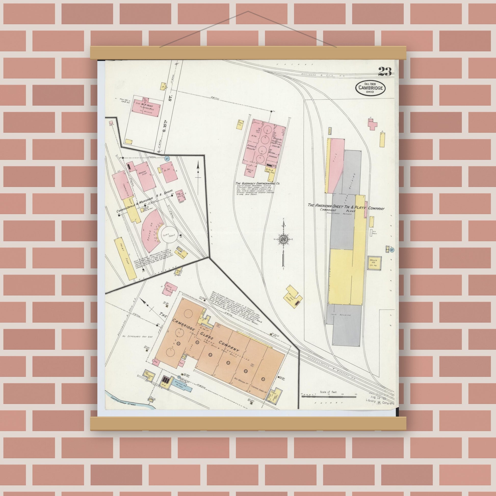 Old map wall art mockup — magnetic wood frame on brick wall — Sanborn Fire Insurance Map from Cambridge, Guernsey County, Ohio (1909), Sheet #0023