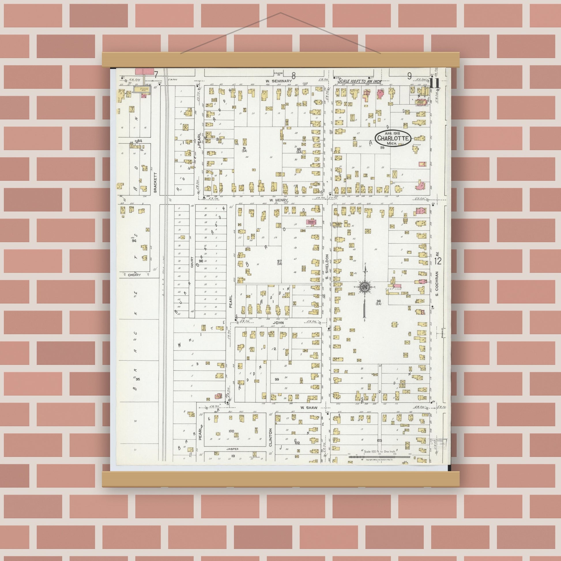 Old map wall art mockup — magnetic wood frame on brick wall — Sanborn Fire Insurance Map from Charlotte, Eaton County, Michigan (1918), Sheet #0011