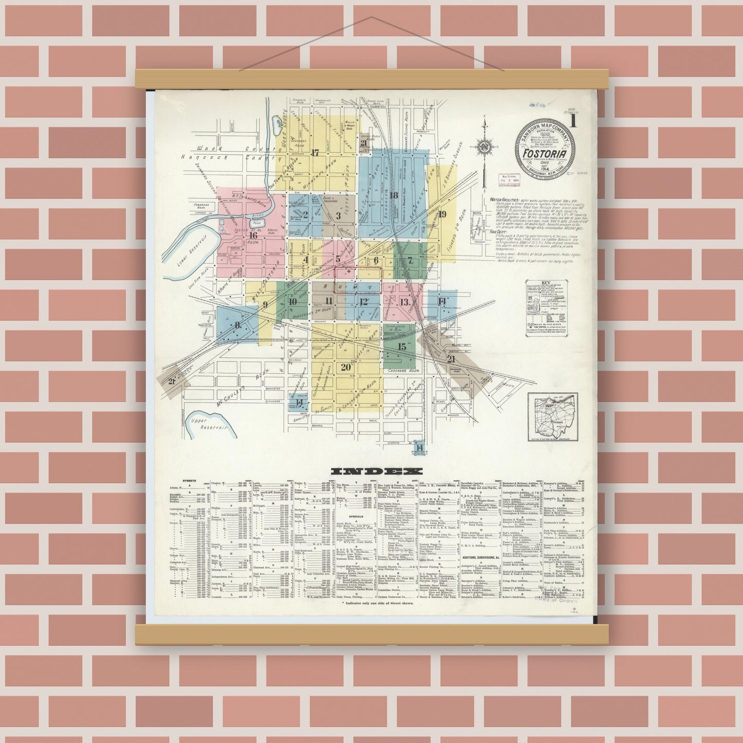 Old map wall art mockup — magnetic wood frame on brick wall — Sanborn Fire Insurance Map from Fostoria, Seneca, Hancock, And Wood Counties, Ohio (1914), Sheet #0001